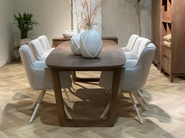 Dining table with an elegant look. Fitted with a stylish U-leg, this table is characterised by its sleek and elegant appearance.