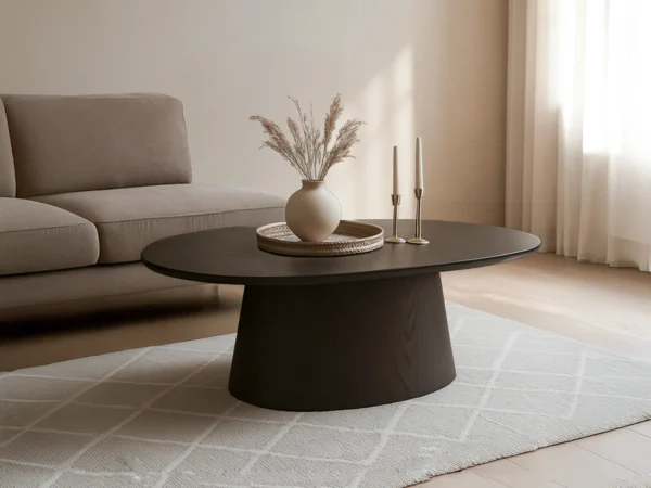 Trendy donkerbruine salontafel met een verfijnde, eikenhouten uitstraling. Deze tafel is uitgevoerd met een ovaal houten blad en ovale onderstel.